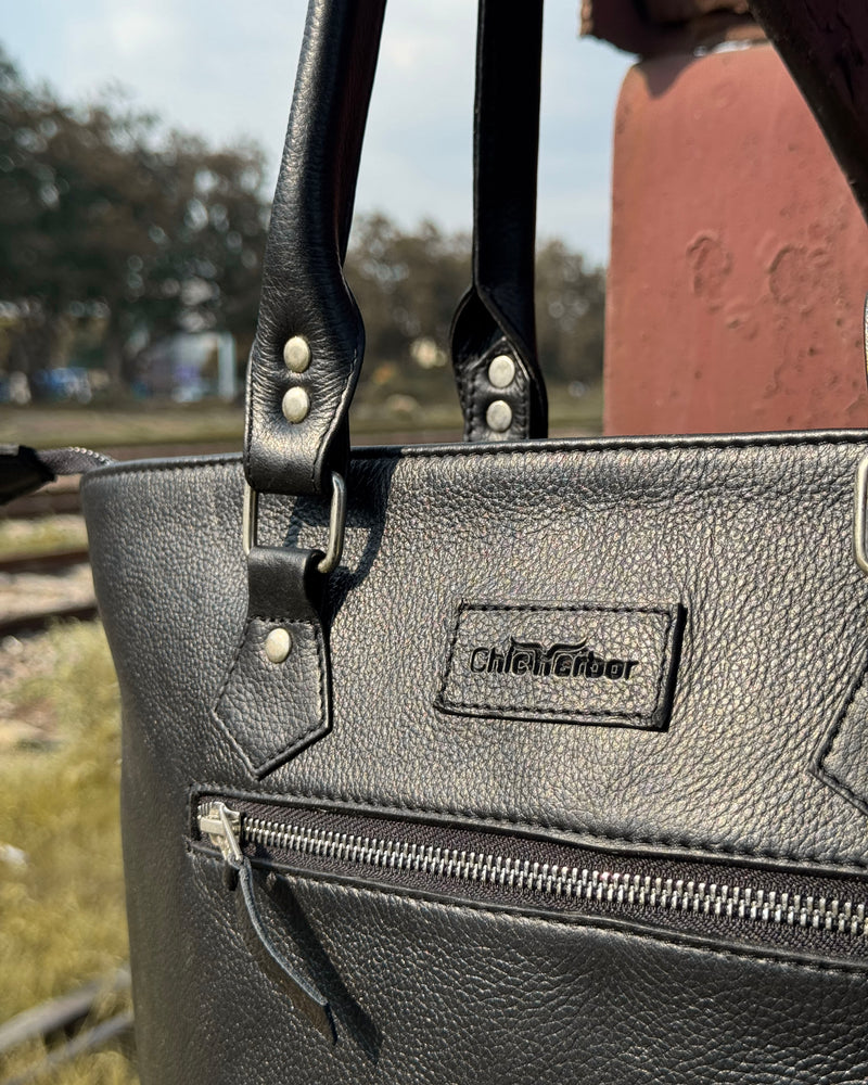 Handcrafted Black Cowhide Fringe Tote with Tooled Leather Panel
